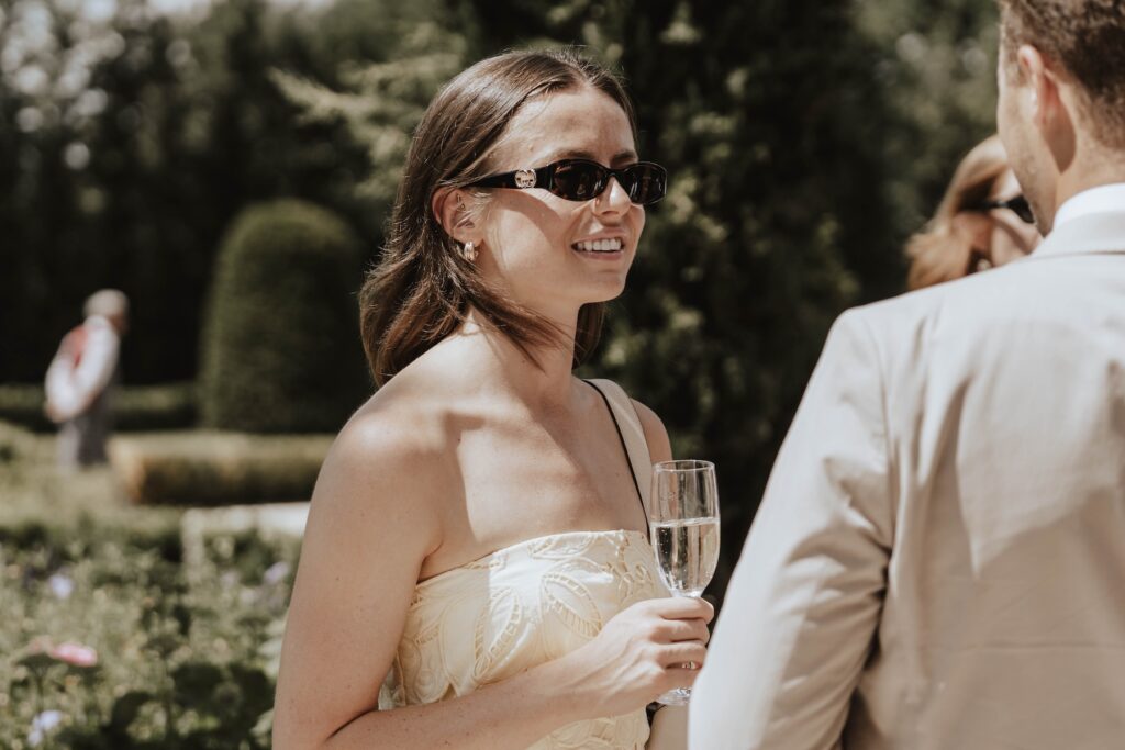 Candid drinks reception photograph at a summer wedding in Suffolk