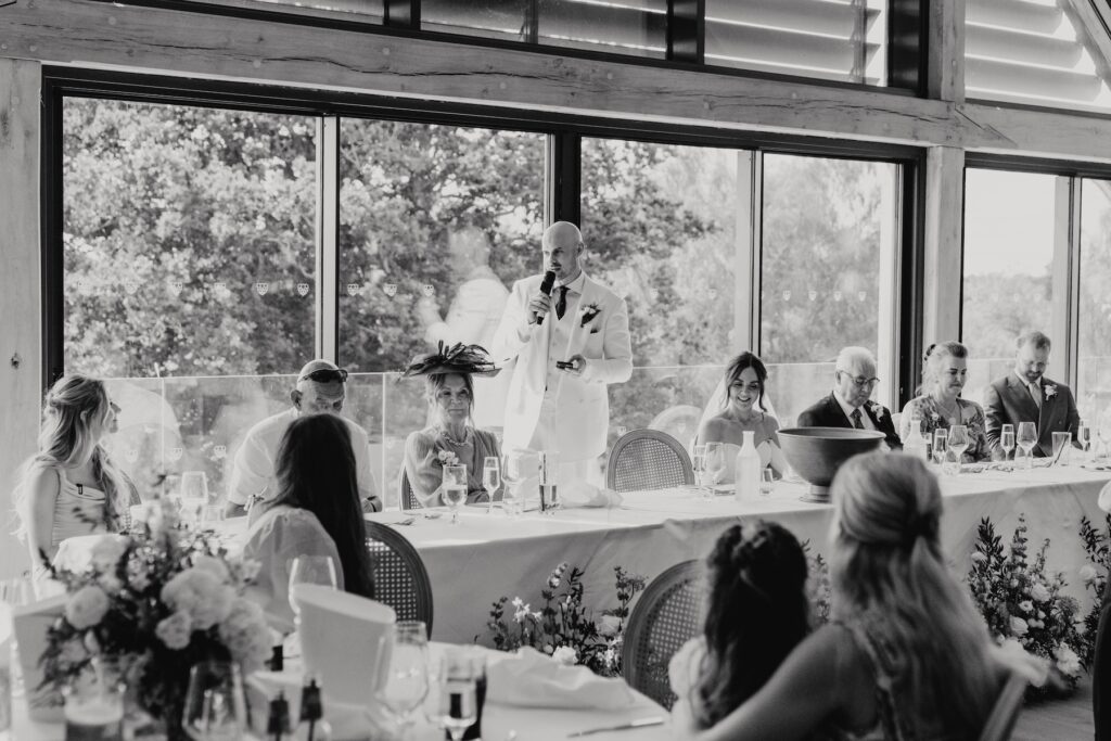 Groom James giving a speech during his wedding reception