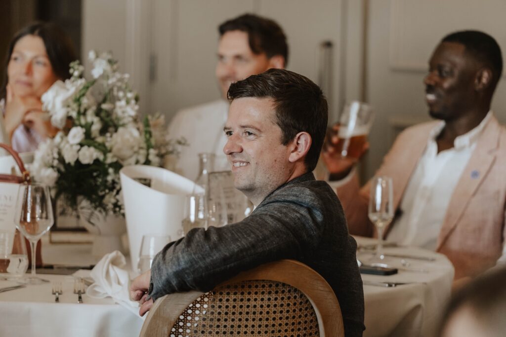 Wedding guests laughing during the speeches at Marquis Suffolk