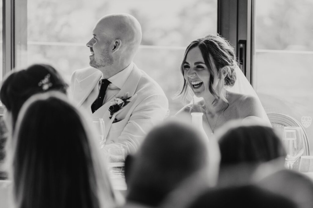 Bride Lauren listening to her father's wedding speech