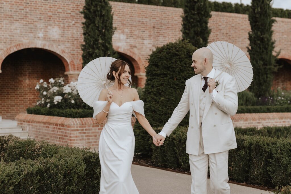 European-inspired wedding portrait with parasols at Marquis Suffolk