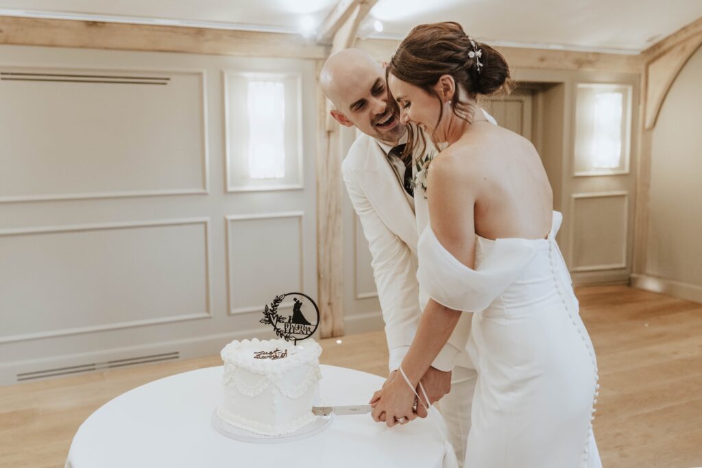 Cake cutting at Lauren and James' wedding at Marquis