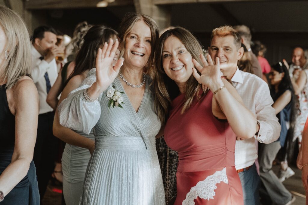 Guests celebrating on the dance floor at a summer wedding in Suffolk