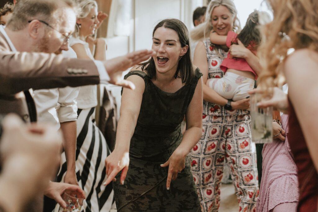 Candid wedding party photograph on the dance floor at Marquis Suffolk