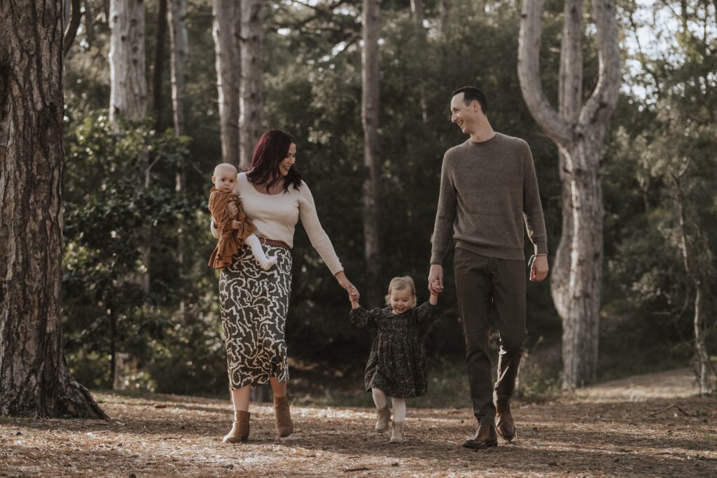 Family portrait of The Browns enjoying time together at Holkham in Norfolk