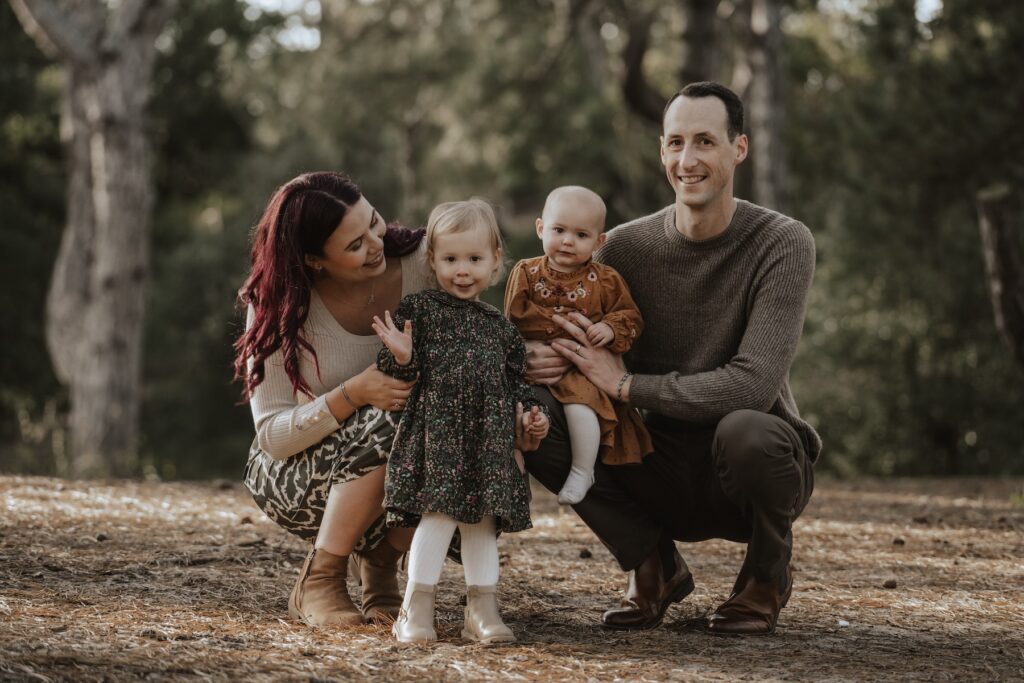 The Browns exploring the beach together during their Norfolk family photography session