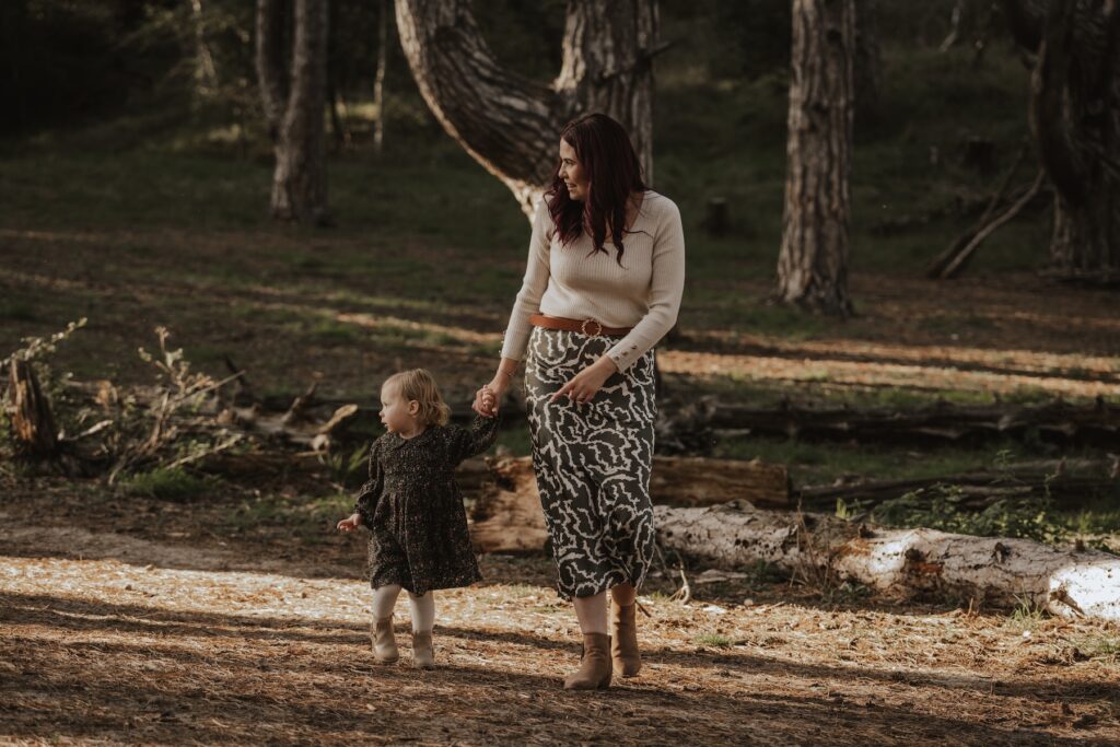 Candid family moment of The Browns playing together on Holkham Beach