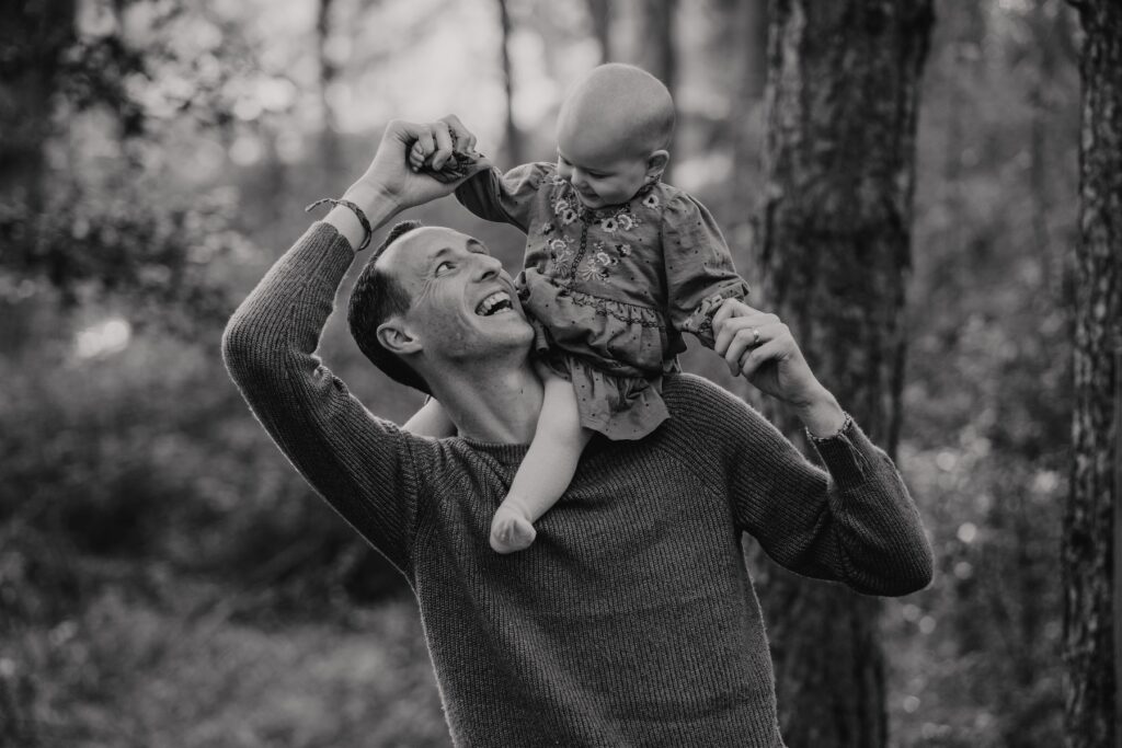 A dad and his daughter during family session at Holkham beach in Norfolk