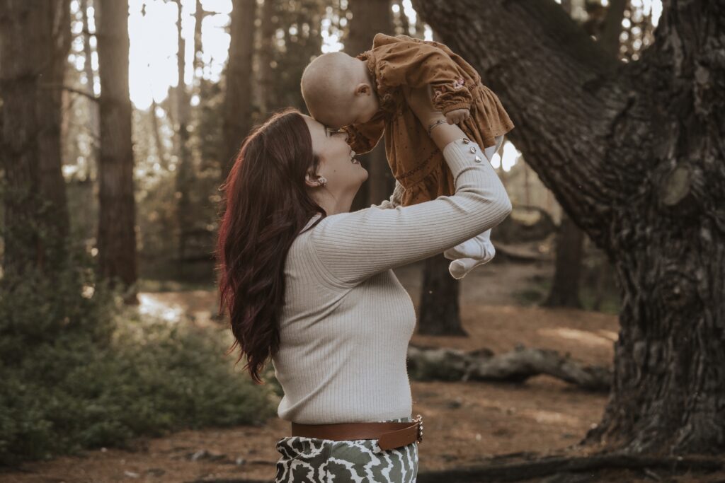 A mum and her daughter during family session at Holkham beach