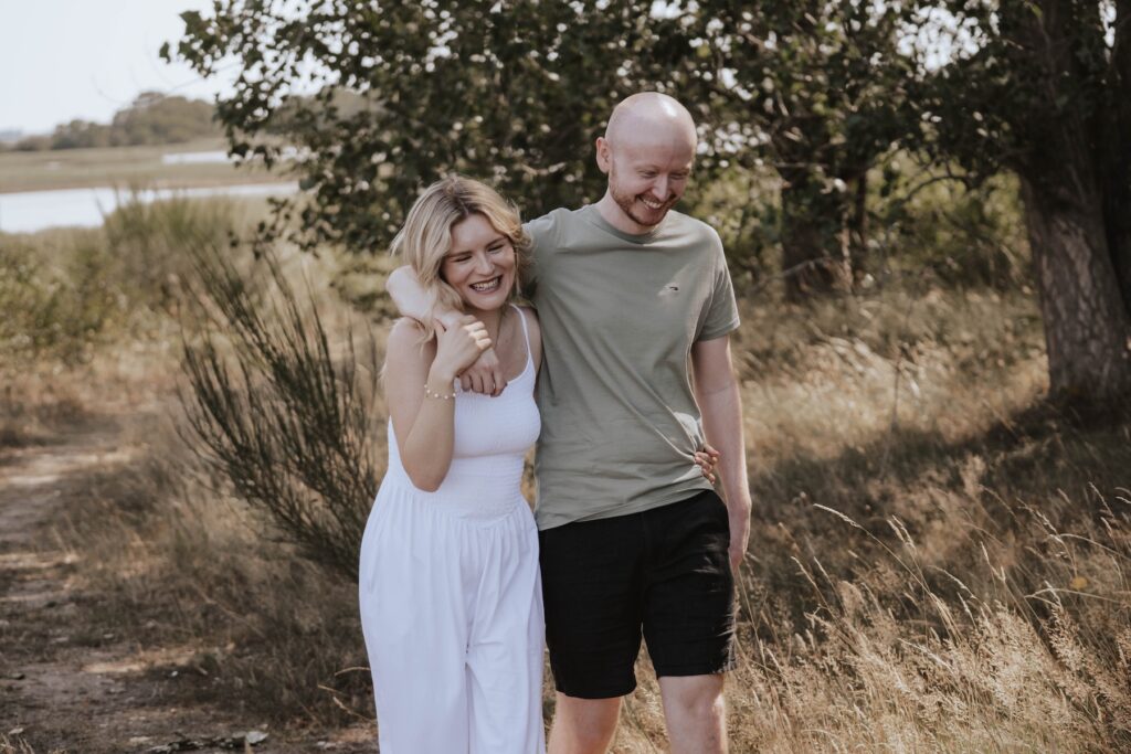 Shannon and Dom enjoying a relaxed couples photography session beside the River Alde at Snape Maltings