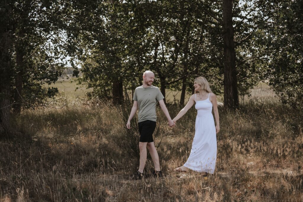 Shannon and Dom enjoying a candid moment together during their Suffolk couples photography session