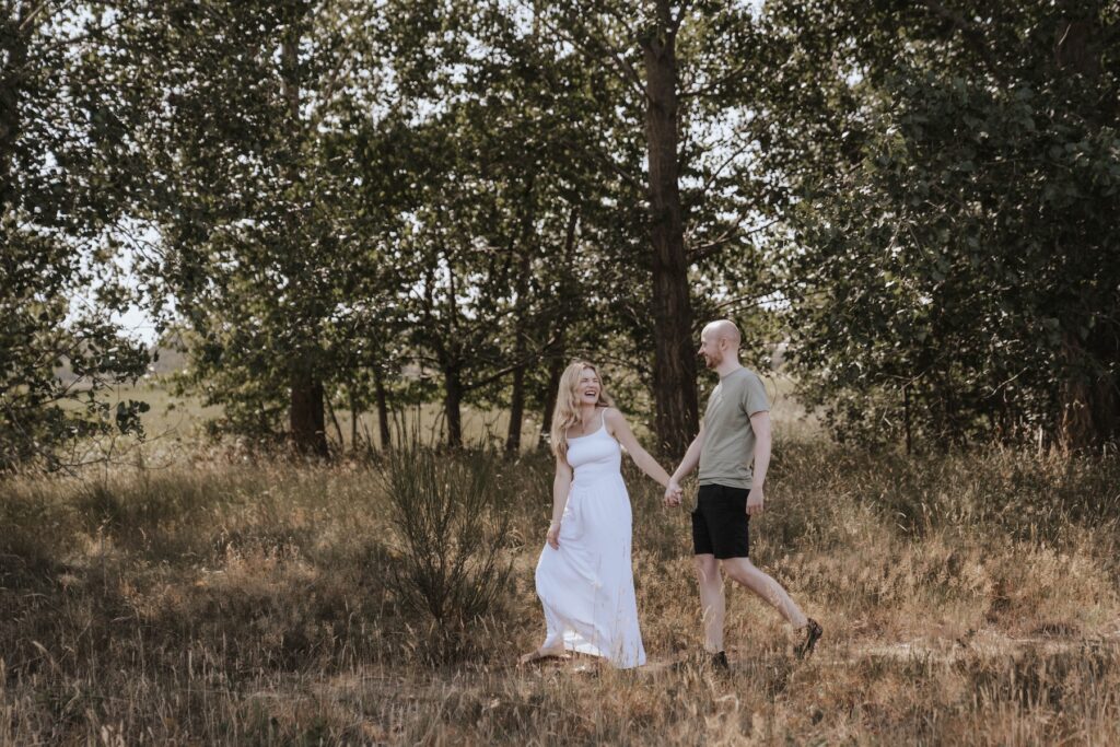 Shannon and Dom sharing a laugh during their relaxed engagement photography session