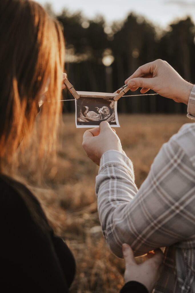 A family photographer capturing a maternity session in Suffolk