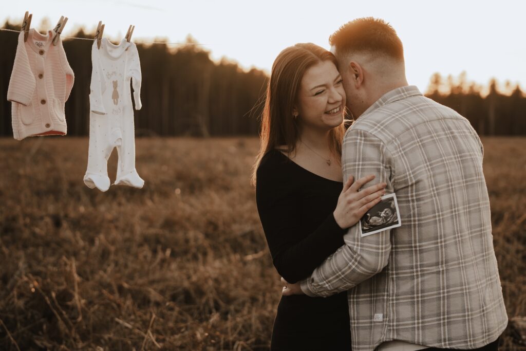 The Carters enjoying a romantic moment together during their Suffolk maternity session